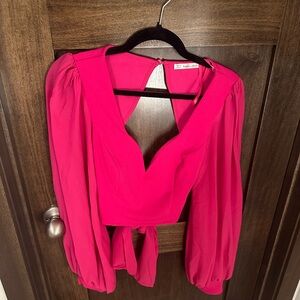Pink blouse with bow in the back